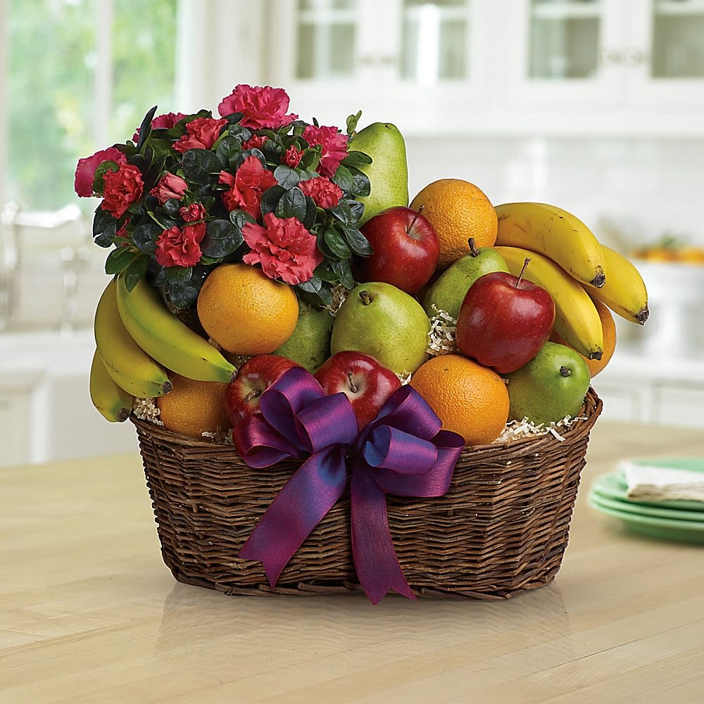 Fruit basket with flowers and a purple ribbon