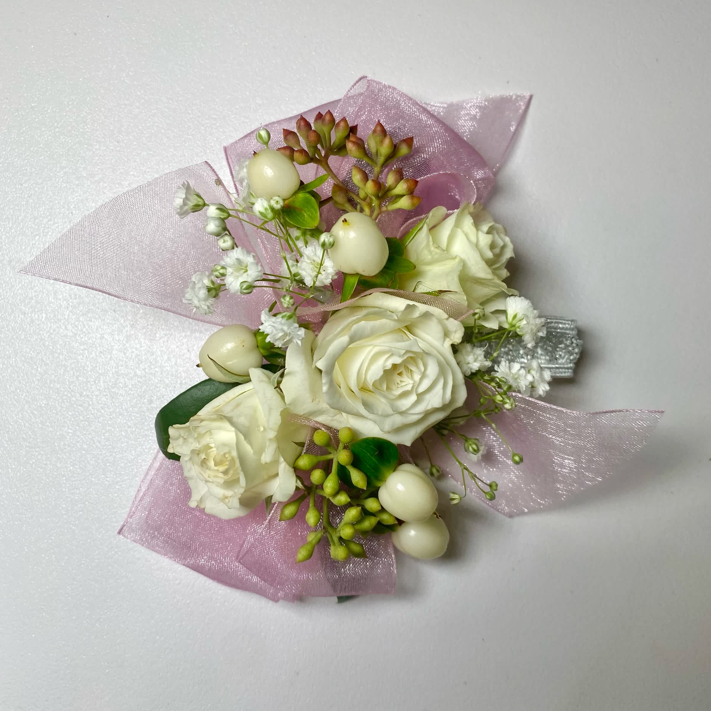 White rose corsage with pink tulle and pearl accents