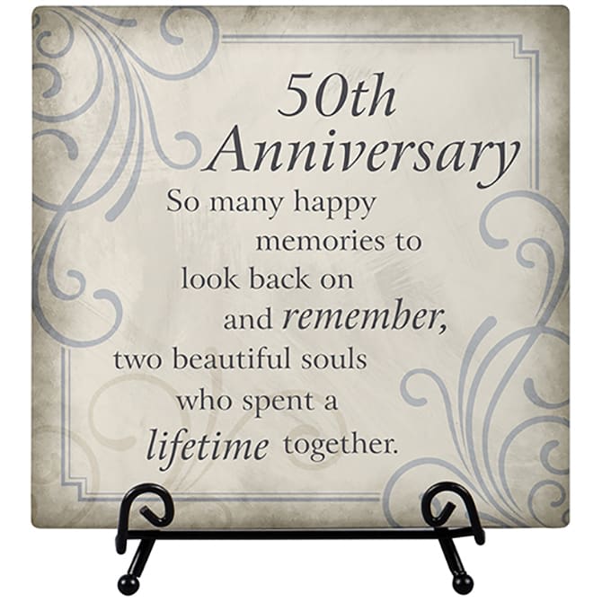 Decorative plaque reading "50th Anniversary" on a stand