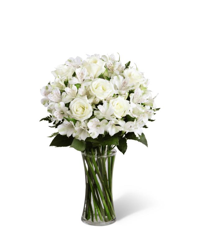 FTD Cherished Friend Bouquet - The FTD Cherished Friend Bouquet offers comfort and sympathy in the  time of grief and loss. Bright white roses and Peruvian lilies are  accented by lush greens and gorgeously arranged in a clear glass  gathering vase to create a bouquet that will bring peace and show how  much you care.    18âh x 12âw