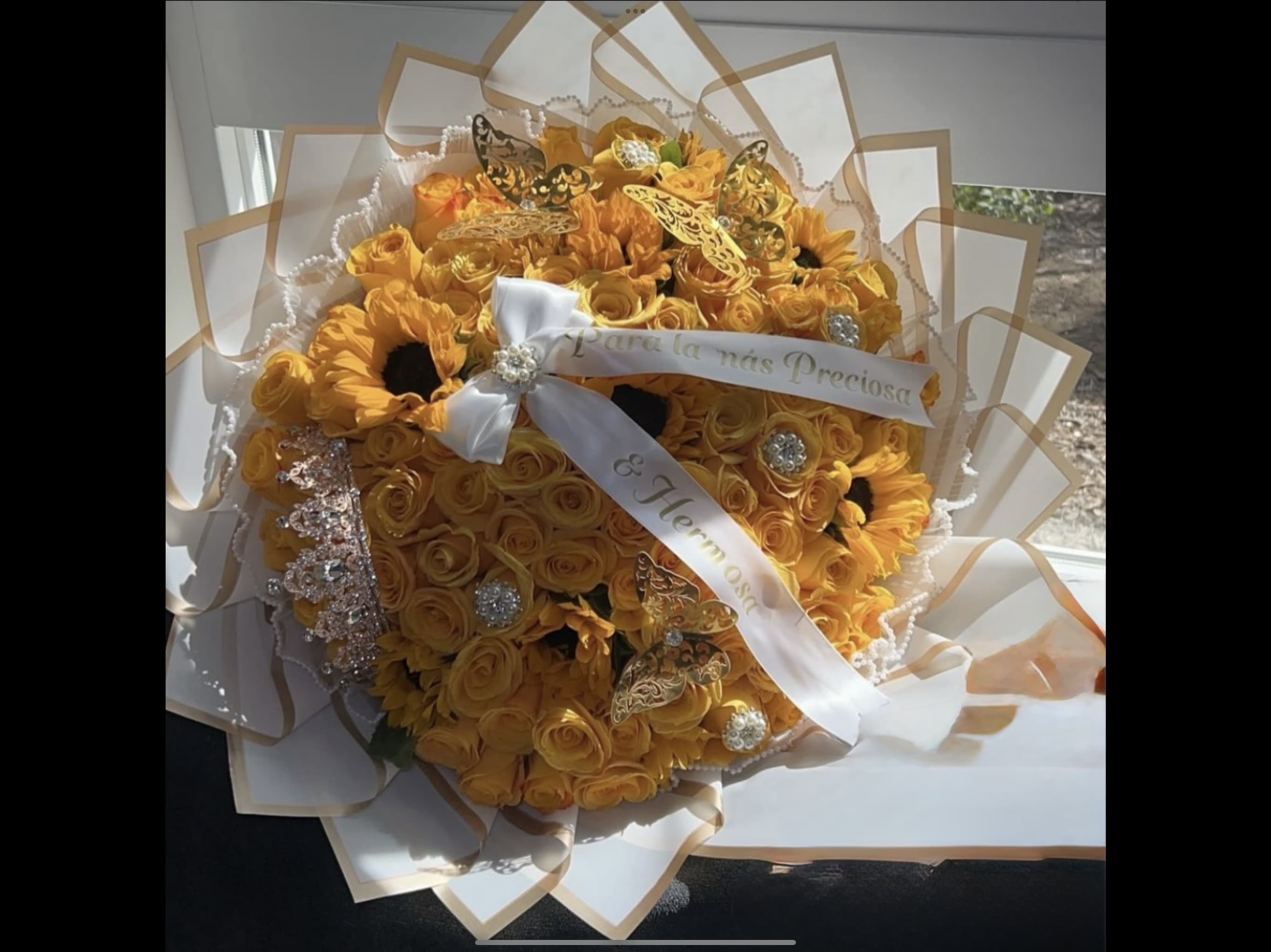 Large yellow rose and sunflower bouquet with white ribbon, jewels, and gold butterfly accents