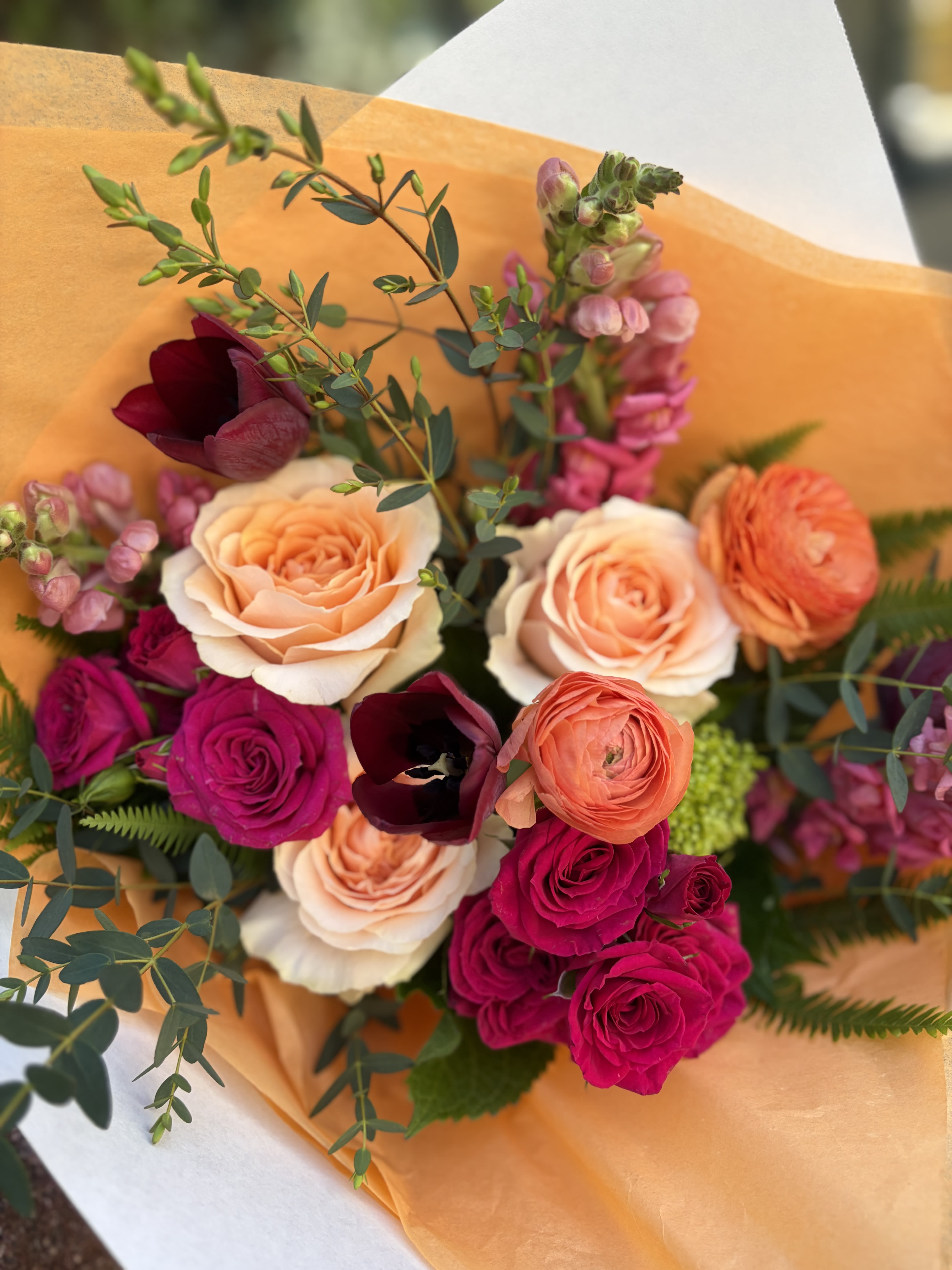 Seasonal Handcrafted Bouquet - A fresh mix of local seasonal flowers wrapped with craft paper, tissue and ribbon. Colors and flower varieties will vary. Please specify if there are any specific colors and/or flowers desired and we will do our best to accommodate you.   PLEASE NOTE: THIS SELECTION COMES WITHOUT A VASE.