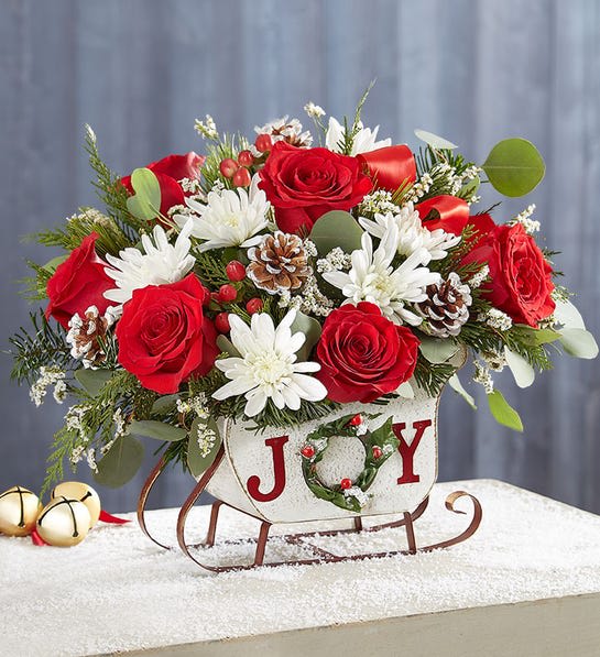 Dashing through the snow - Joy sleigh with xmas greens and fresh flowers, picture shown is premium