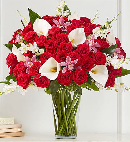 ELEGANT EXTRAVAGANZA - WOW HER WITH THIS ELEGANT BOUQUET OF ROSES, CALLA LILIES, ORCHIDS ONLY PREMIUM FLOWERS.  PICTURE SHOWN IS PREMIUM SIZE