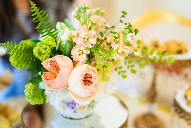 Juliet - English garden inspired arrangement with unique flowers and foliage in unique vase.