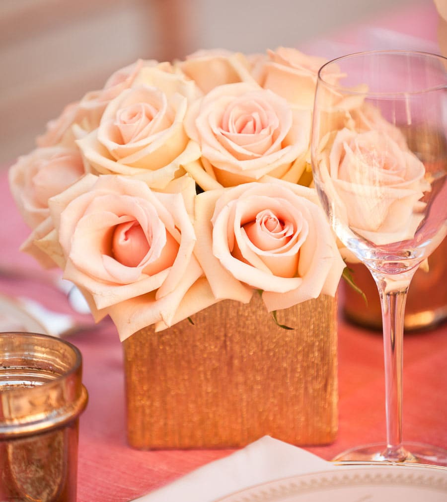 Angelica - Classic arrangement with pave of blush pink roses in a gold textured vase. Approx. 8" W and 8" H  