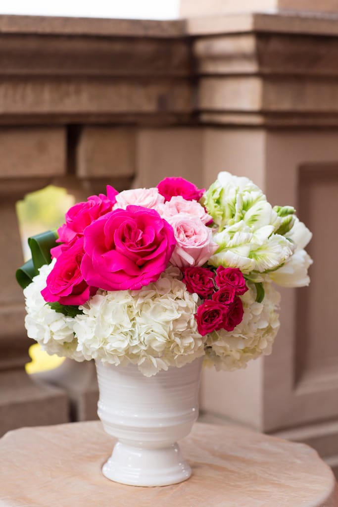 Pink and white rose bouquet in a white vase