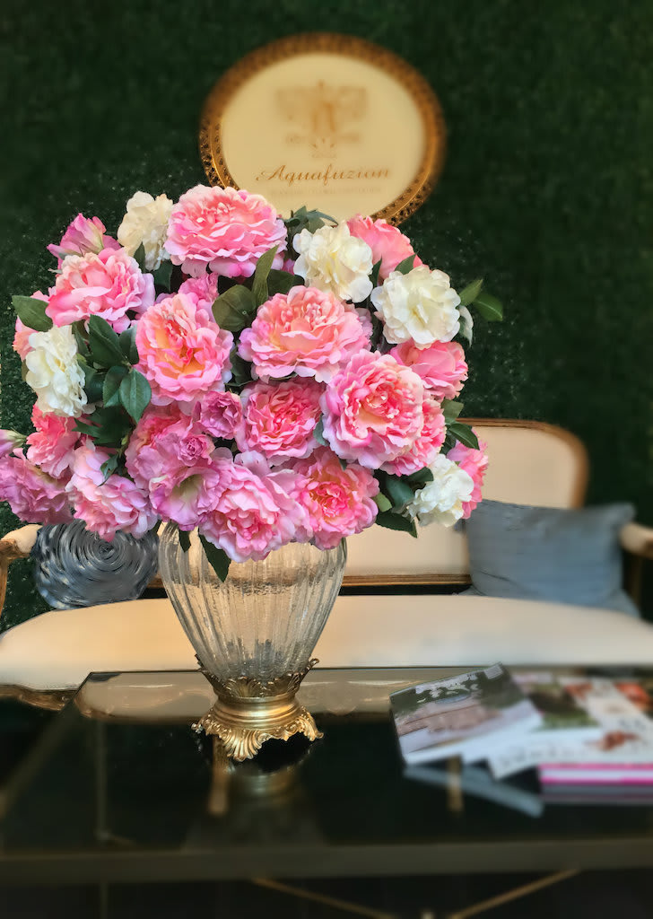 Pink and white flower arrangement in a glass vase