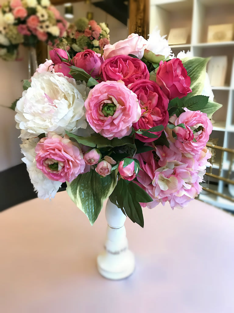 Pink and white flower bouquet in a white vase