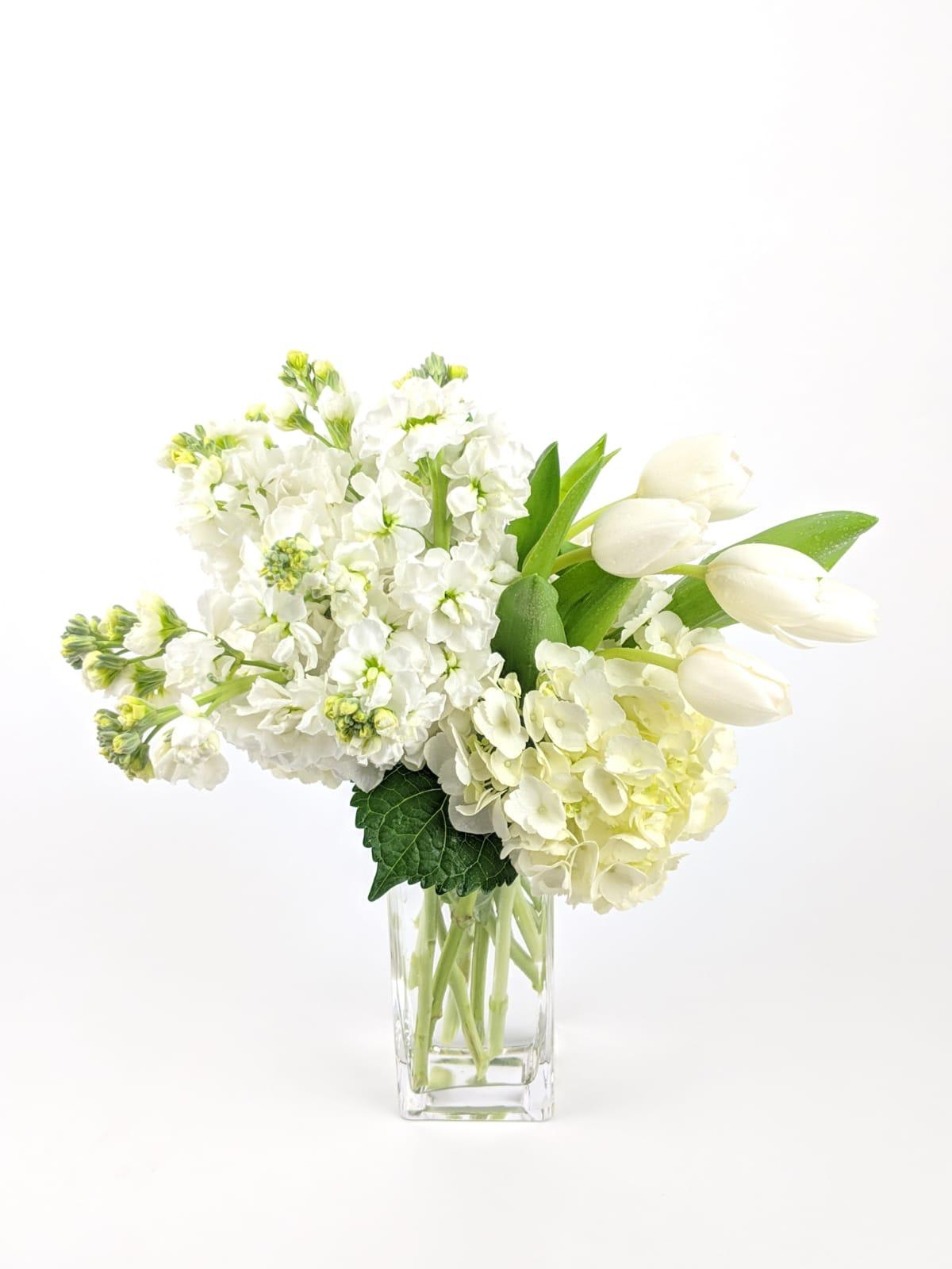 White flowers arranged in a clear glass vase
