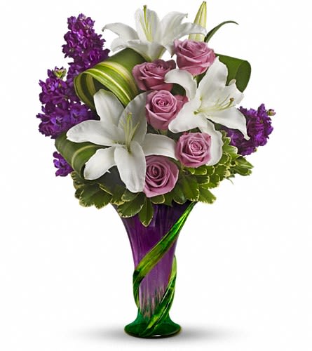 Bouquet of white lilies, pink roses, and purple flowers in a purple vase