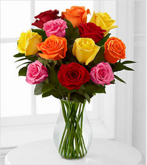 Mixed 1 Dozen Long Stem Roses  - Picked fresh from the farm to offer your special recipient a bouquet that brings brilliant color to any of life's special occasions. Our Long Stemmed Mixed Rose Bouquet will delight your special recipient with each fragrant bloom. Hand gathered in select floral farms and boasting an array of bright hues, this flower arrangement has been picked fresh for you to help you celebrate a birthday, anniversary, or express your thank you wishes. This bouquet includes the following: mixed roses and an assortment of lush greens. Available with a selection of vases to fit your gifting needs. GOOD bouquet is approximately 16"H x 14"W. 50cm Roses are reduced to be proportionate to the vase, providing a good customer experience. Your purchase includes a complimentary personalized gift message.