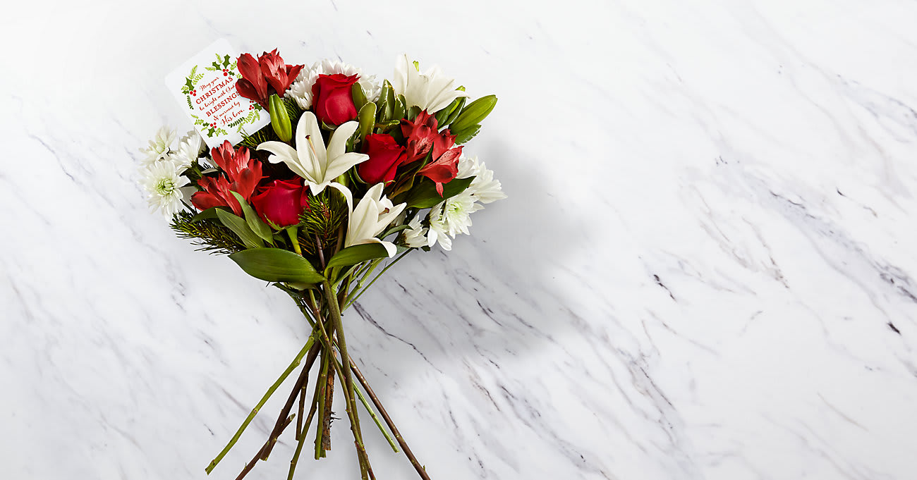 Bouquet of red roses, white lilies, and white daisies