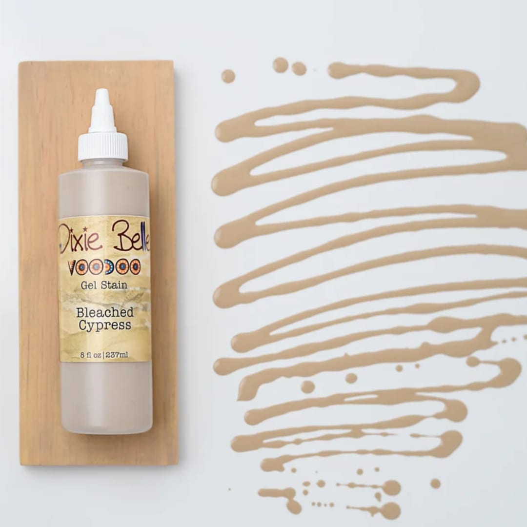 Bottle of gel stain on a wood board beside tan paint swatches