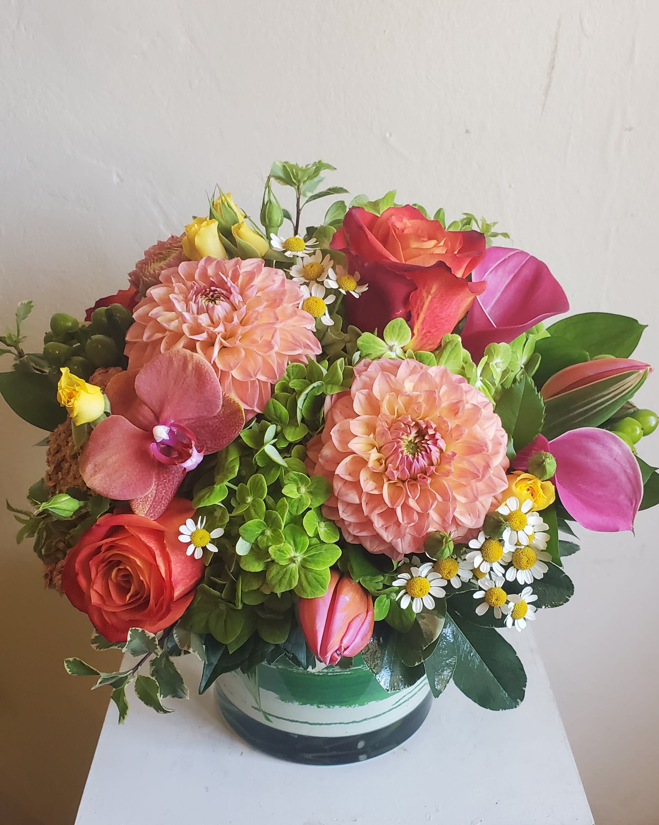 Summer Splash - Bright arrangement with green hydrangea, bright orange/ or hot pink roses, dahlias, calla lilies. and matching bright summery flowers