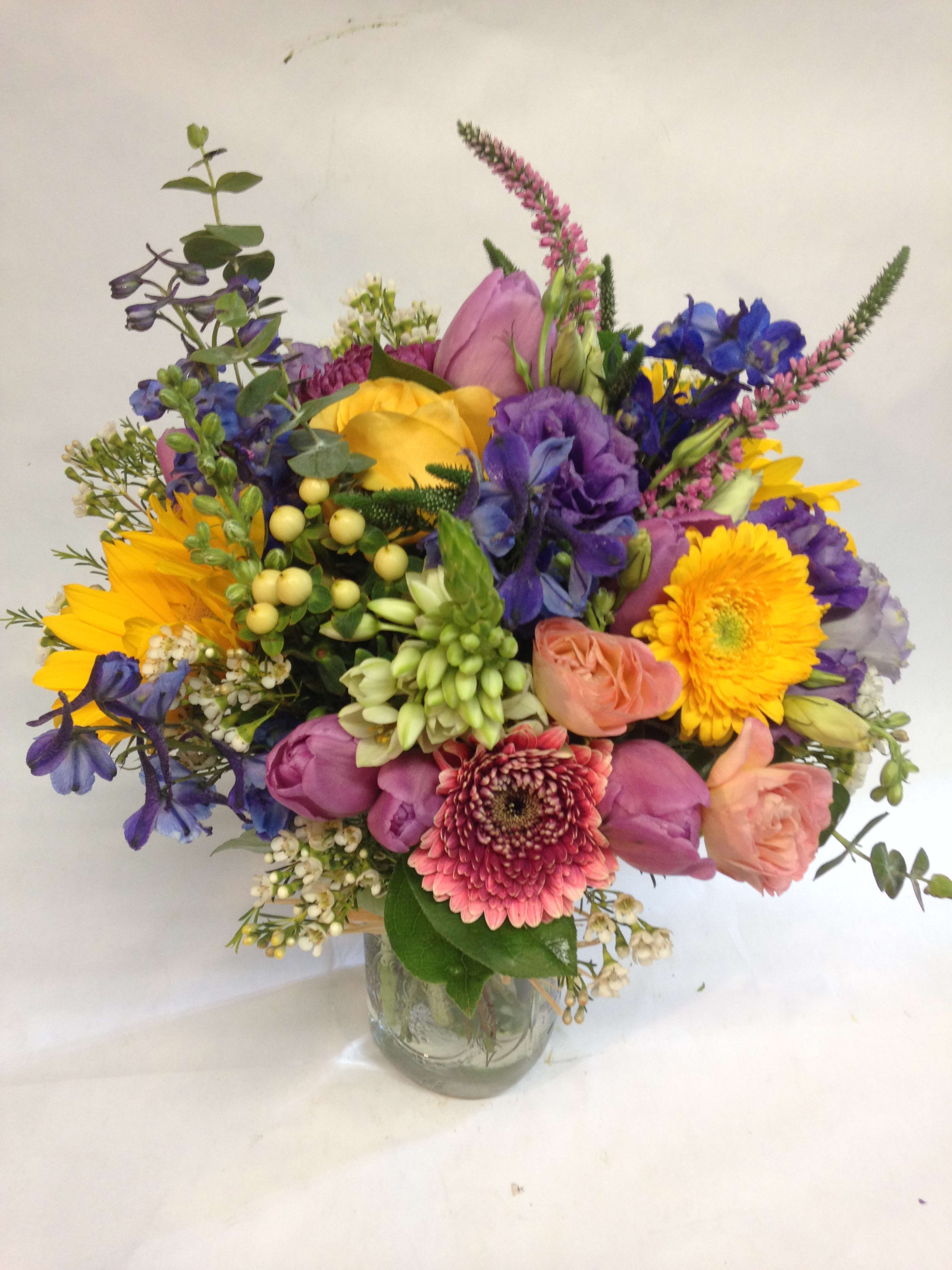 Colorful mixed bouquet in a clear glass vase