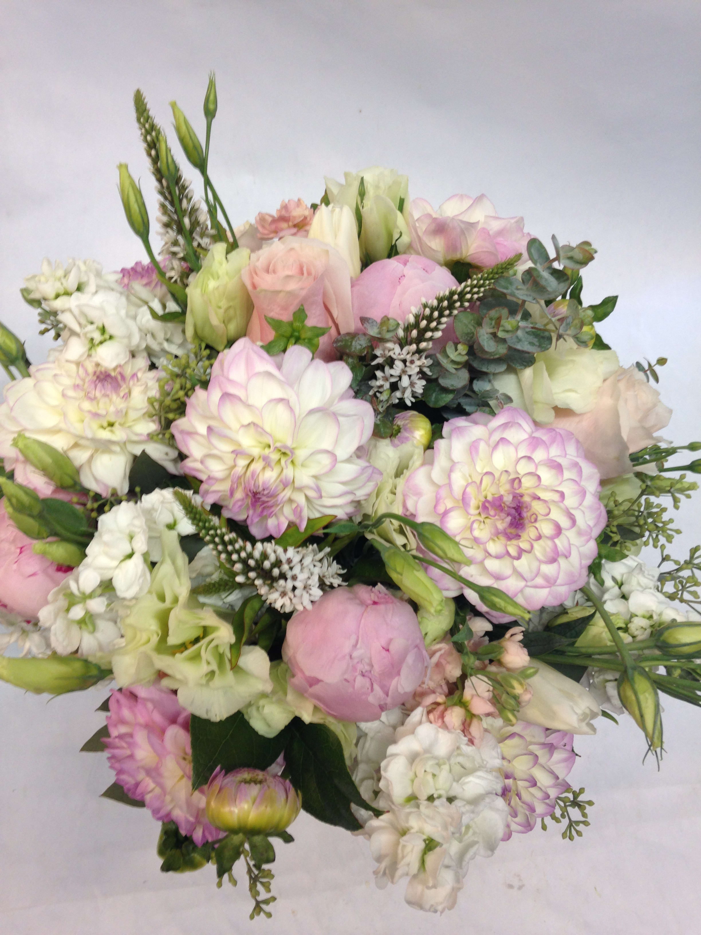 Pastel bouquet of pink and white flowers with eucalyptus