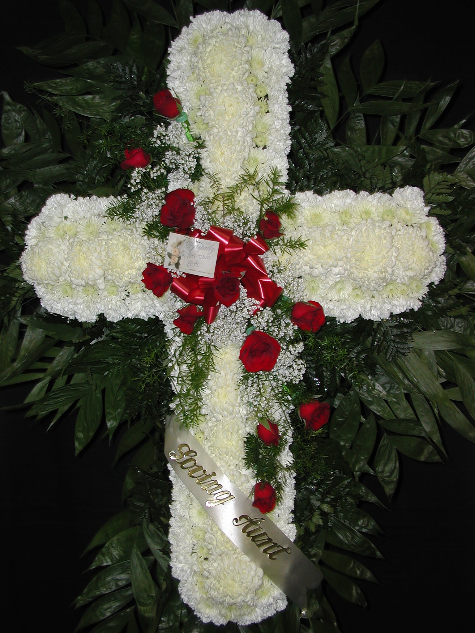 White Standing Cross with Red Rose's - White Cross with a spray of red roses going through