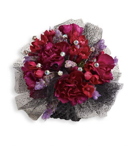 Bouquet of deep pink and purple flowers with black mesh wrapping