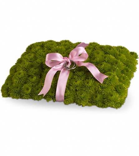 Rectangular green floral arrangement with a pink ribbon bow