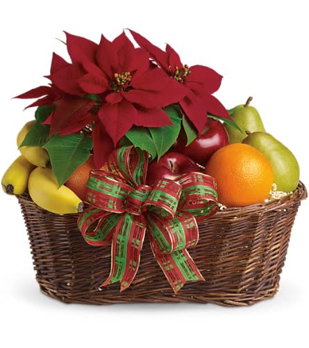 Fruit basket with poinsettias and a plaid ribbon