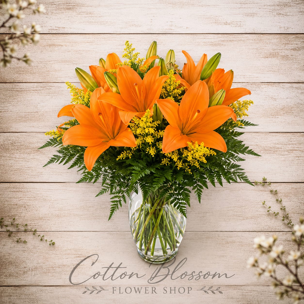 Sunrise Lilies - The gift of a beautiful sunrise captured in flowers. Bursting with vibrant orange lilies and golden accents, this cheerful arrangement brings the warmth and promise of a new day to any room. Like that first sip of coffee in the morning, it's uplifting, comforting, and sure to brighten the heart of someone special. Presented in a clear glass vase and designed all around, this handcrafted arrangement is perfect for birthdays, celebrations, get-well wishes, or simply reminding someone they're loved. Lilies may arrive in various stages of bloom to ensure lasting beauty and enjoyment as they continue to open. 