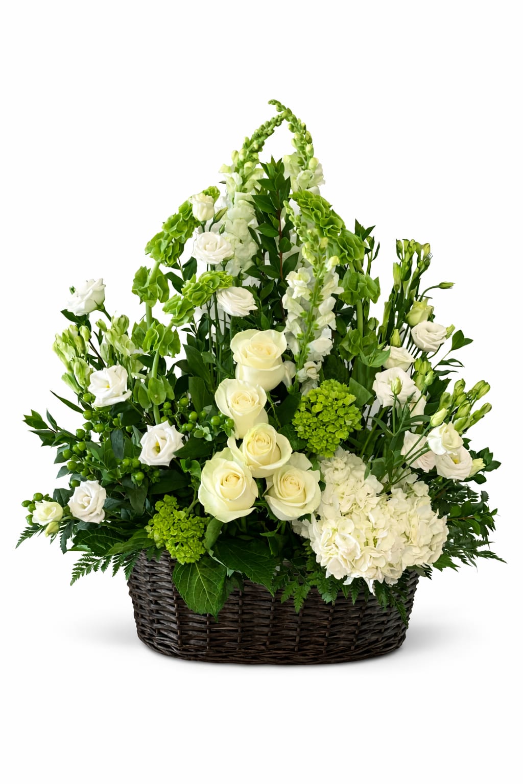 White roses and green flowers arranged in a wicker basket