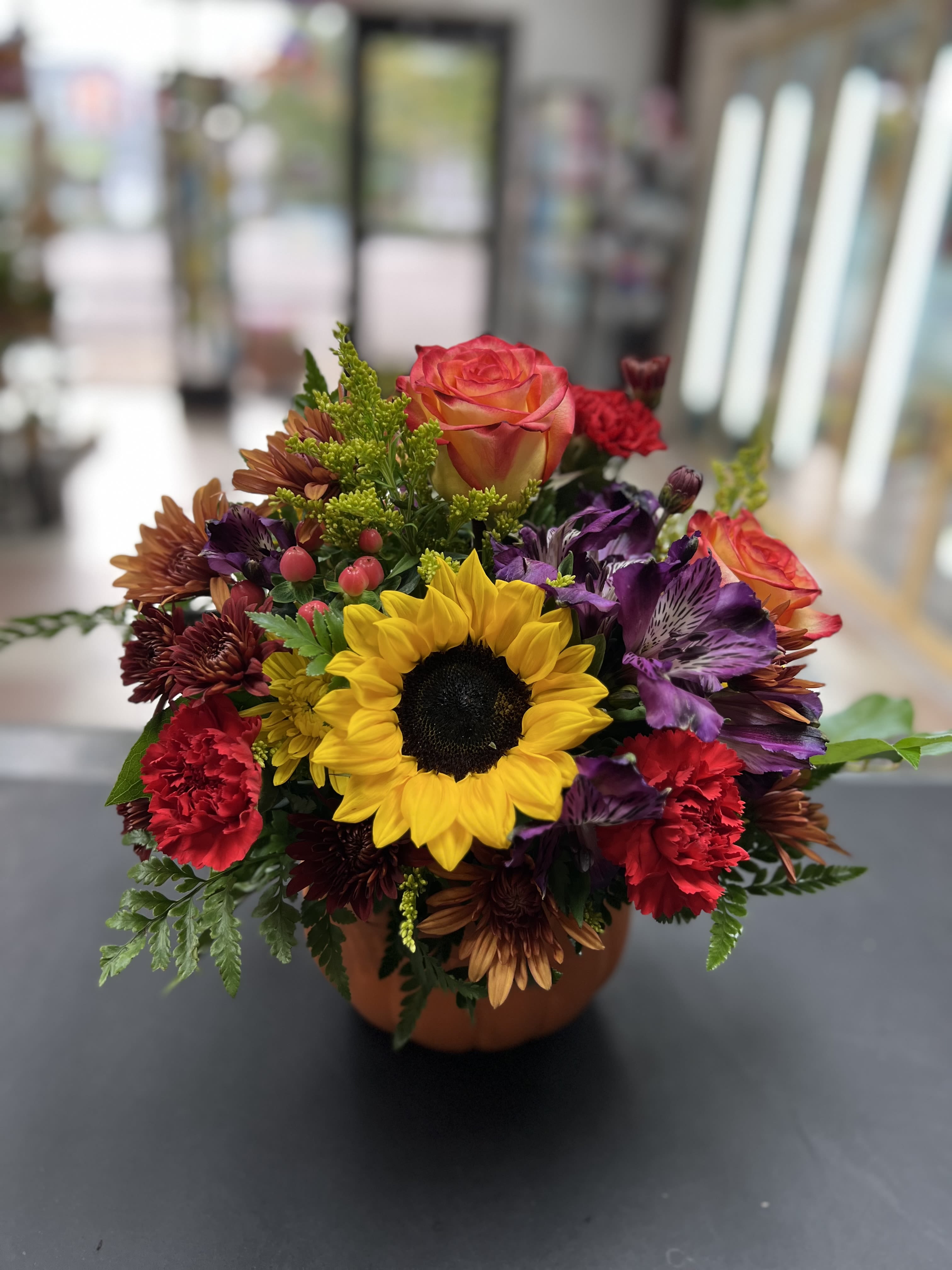 Pretty Pumpkin Petals - Here is a sweet treat to celebrate the beauty of fall!  Beautiful flowers arranged in a keepsake pumpkin pot.