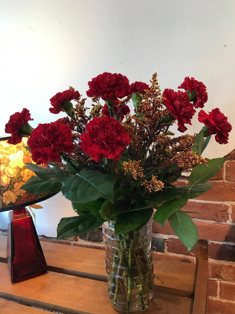 Autumn Carnations - A large vase arrangement filled with greenery, a dozen fall colored carnations with filler