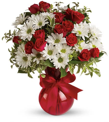Red roses and white daisies in a red vase with a ribbon