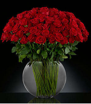 Breathless Luxury Rose Bouquet  - They leave you breathless with every kiss. Sweep them off their feet with 24-inch premium long-stemmed red roses. Each stem flaunts the beauty of their beautiful swirling petals, gorgeously situated in a sophisticated clear glass 13-inch pillow vase, to astound and amaze your special someone with the bounty of their timeless elegance. Includes: 50 Red 60cm roses, 50 dark red 60cm roses, one large glass pillow vase Approx. 33H x 38W Your purchase includes a complimentary personalized gift message.
