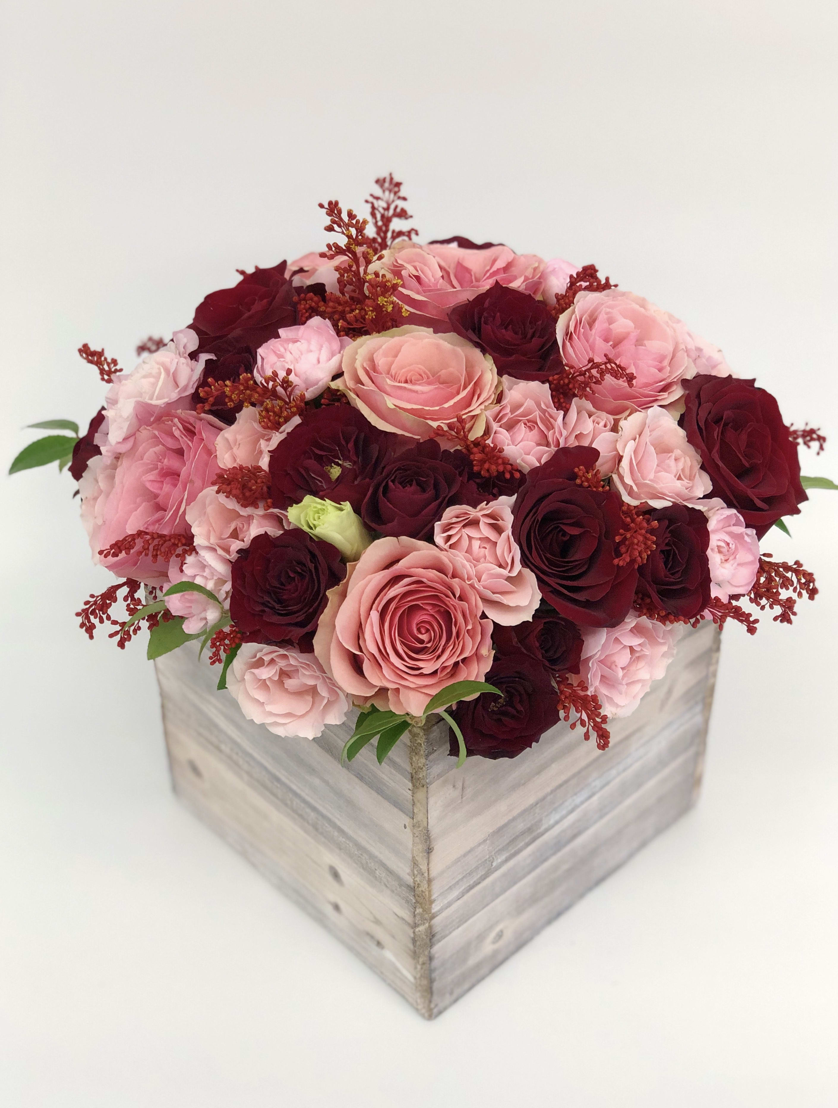 Large Wood box arrangement Red &amp; Pink  - Mixed flowers, from romantic and gentle to an edgy and interesting look. If You want a bouquet with a twist, choose our flower boxes. We have wood boxes for rustic-looking arrangements or hat boxes for a more elegant look. It’s a beautiful and convenient way. Flowers in boxes don’t need vases. That makes it perfect for transportation and keeping flowers hydrated and secure.