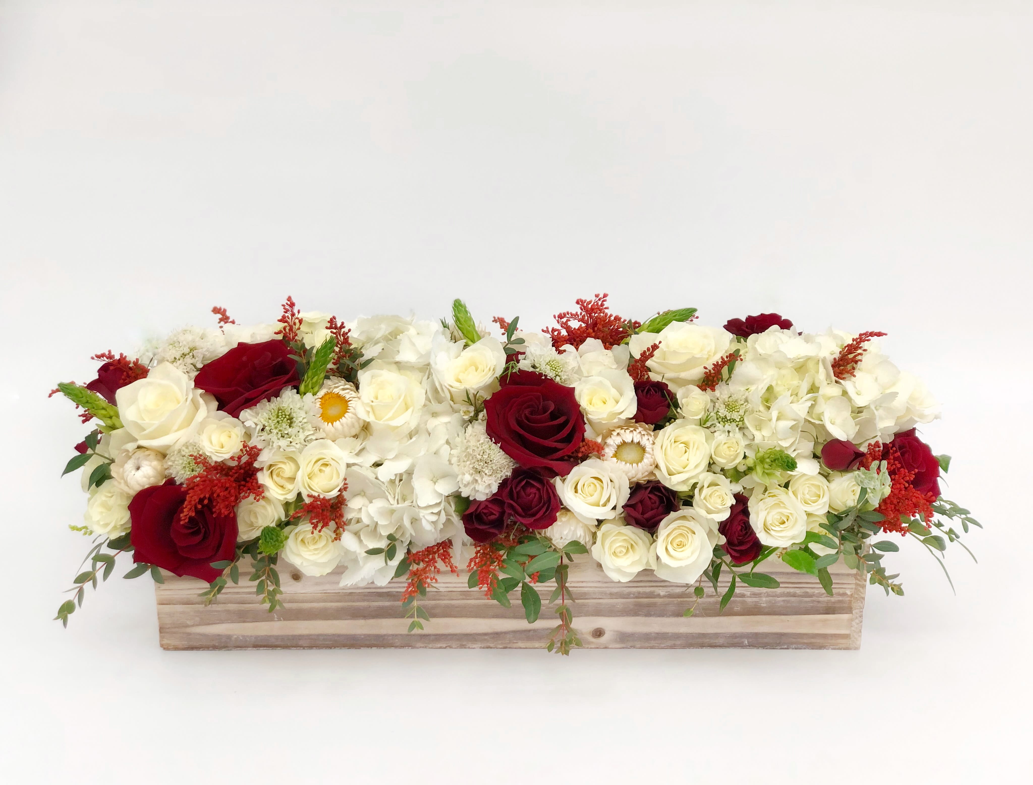 Red and White long wood box  - If You want bouquet with a twist, choose our flower boxes. We have wood boxes for rustic looking arrangements, or hat boxes for a more elegant look. It’s a beautiful and convenient way. Flowers in boxes don’t need vases. That makes it perfect for transportation and keeping flowers hydrated and secure.