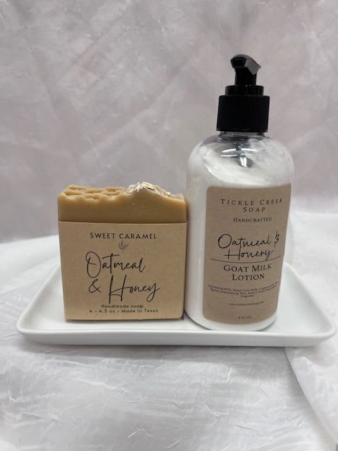 Soap bar and lotion bottle on a white tray