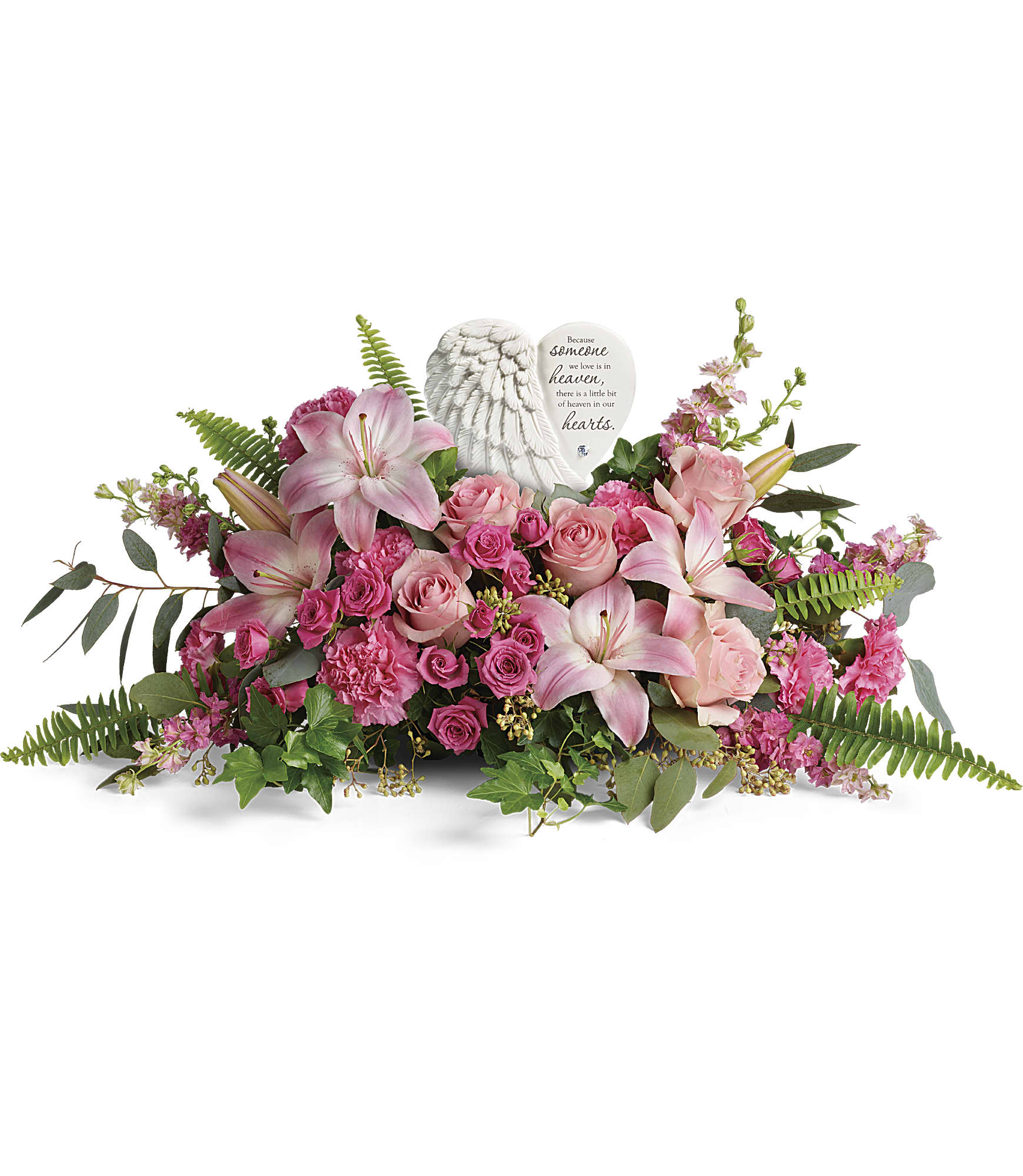 Pink lilies and roses arranged around a memorial angel heart plaque