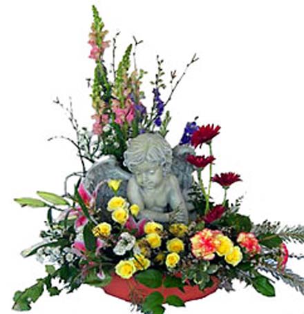 Floral arrangement with a cherub statue and mixed flowers in a low container