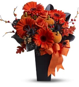 Jack-O'-Lantern Blooms - A jack-o'-lantern is the most celebrated symbol of Halloween; and this bold 'n' spooky floral gift features flaming-orange flowers and pumpkins, plus stems and leaves that are as dark as night. Send this glam gift to a friend or business associate, for a true Halloween treat!