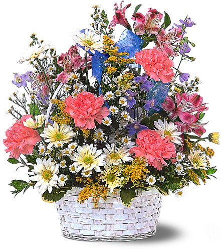 Mixed bouquet in a white woven basket with pink carnations and daisies