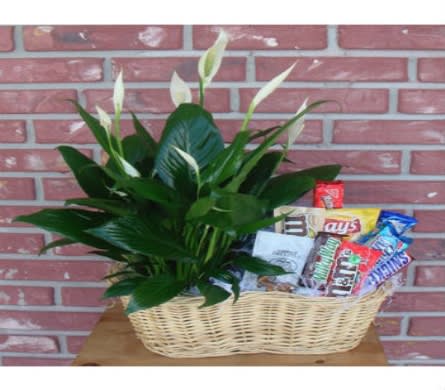 Basket of white peace lilies with assorted candy bars