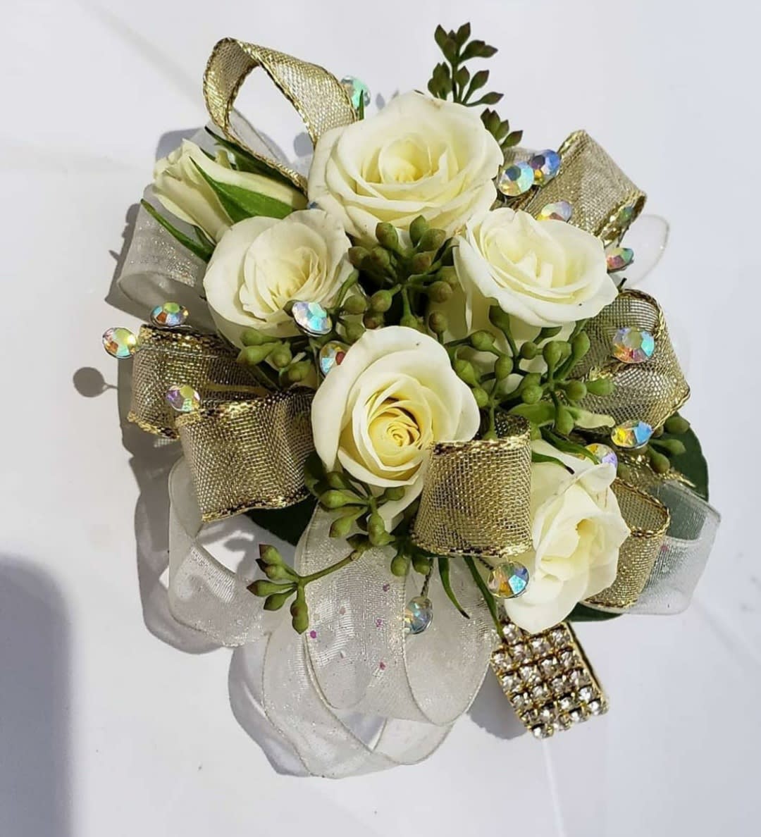 White rose bouquet with gold and sheer ribbon accents