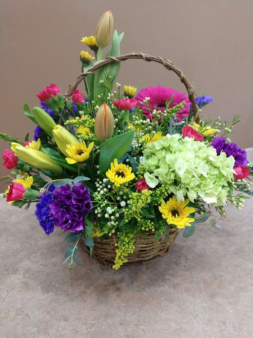 Mixed flower basket with tulips, daisies, hydrangea, and carnations
