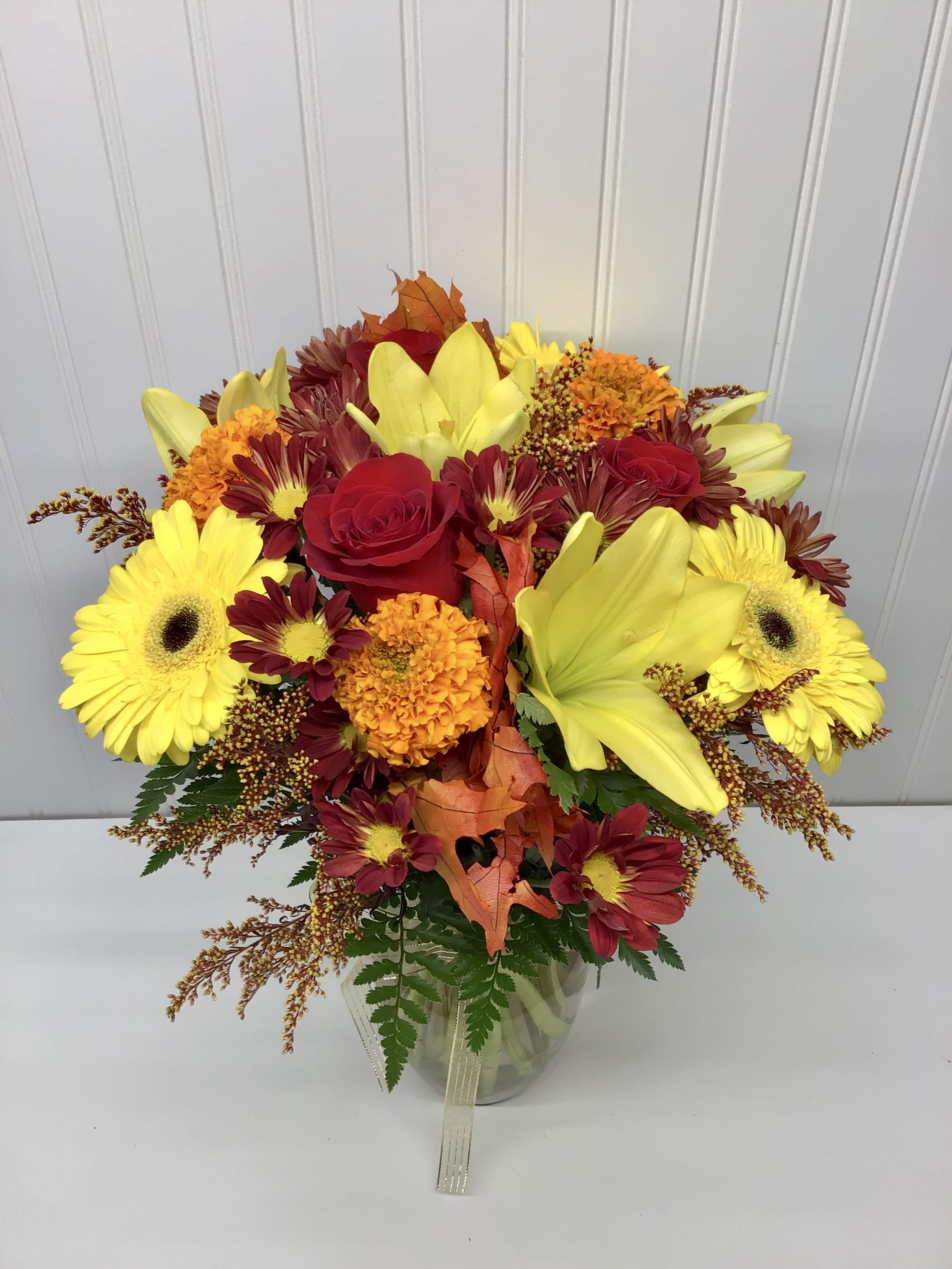 Autumnal feel  - Autumn is all about color. Designed with the vibrant shades of the season, this beautiful bouquet comes with an  assortment of texture and colored
