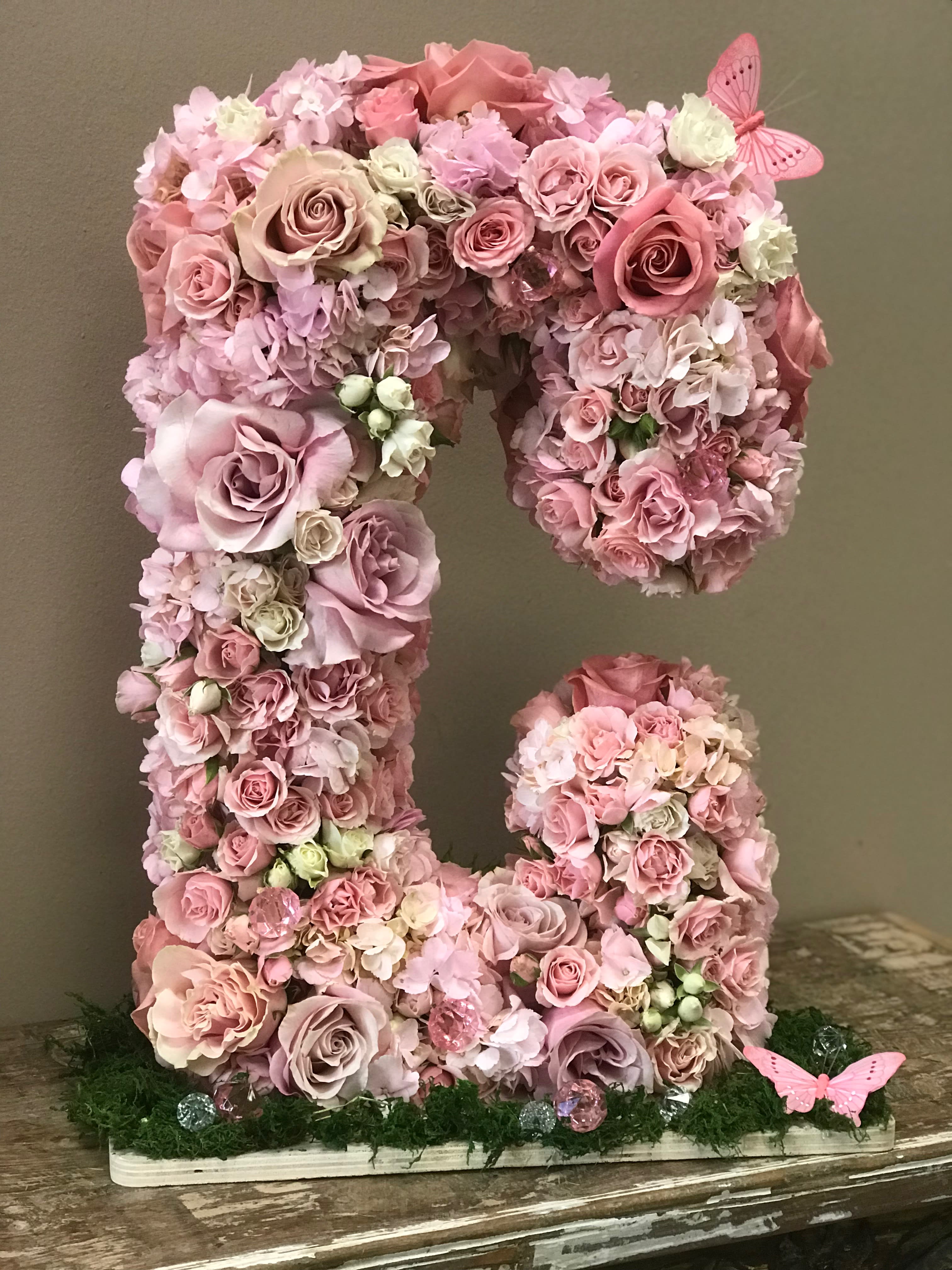 Pink floral letter arrangement with roses and hydrangeas