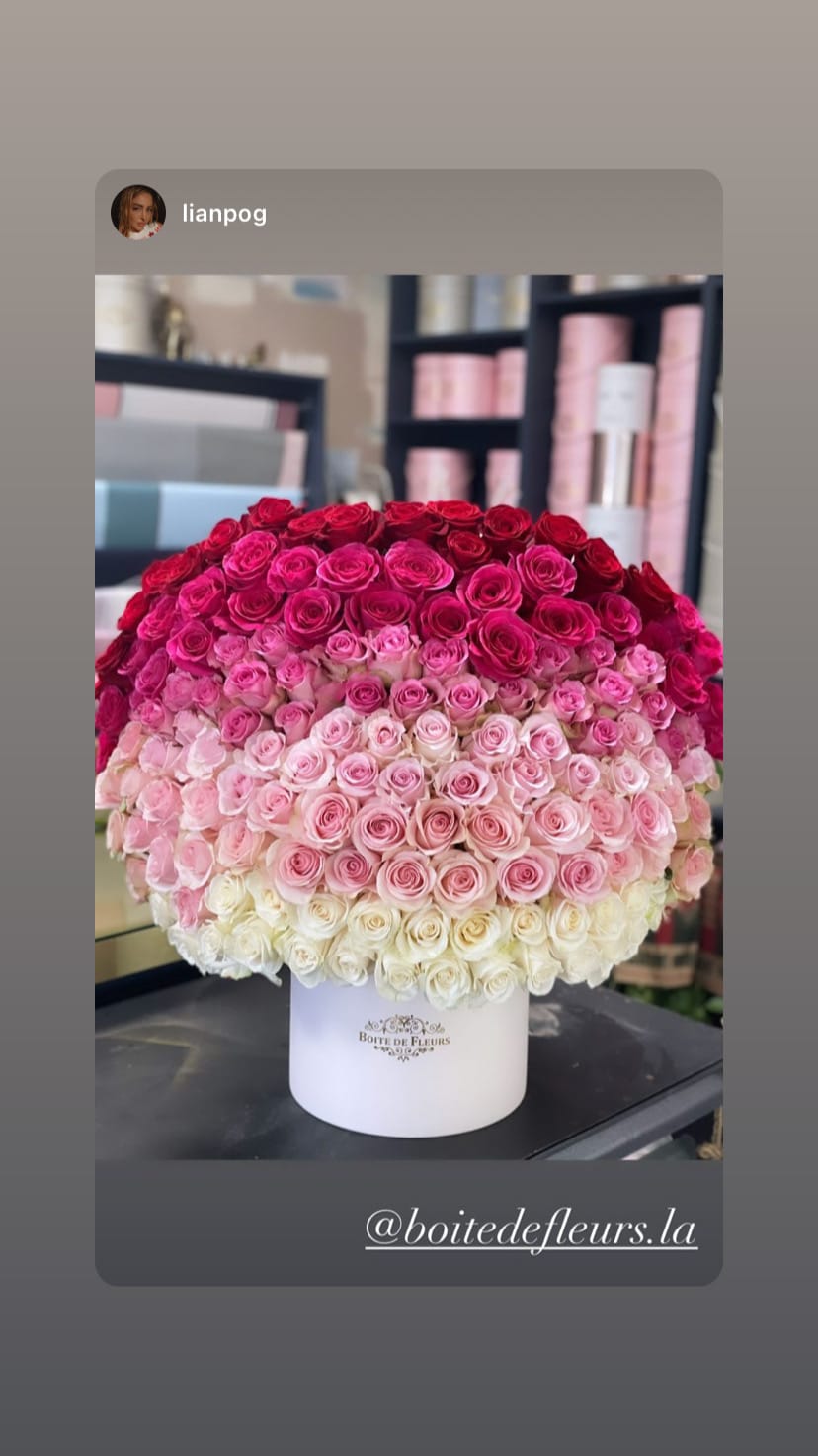 Large ombré bouquet of pink and red roses in a white hat box