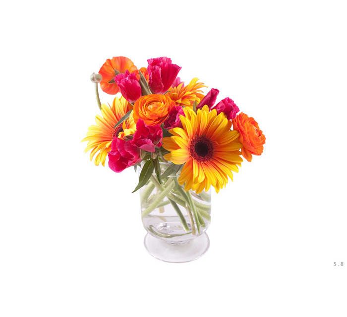 Bright mixed bouquet in a clear glass vase
