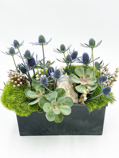 Tracy - Arrangement includes a crystal geode. 