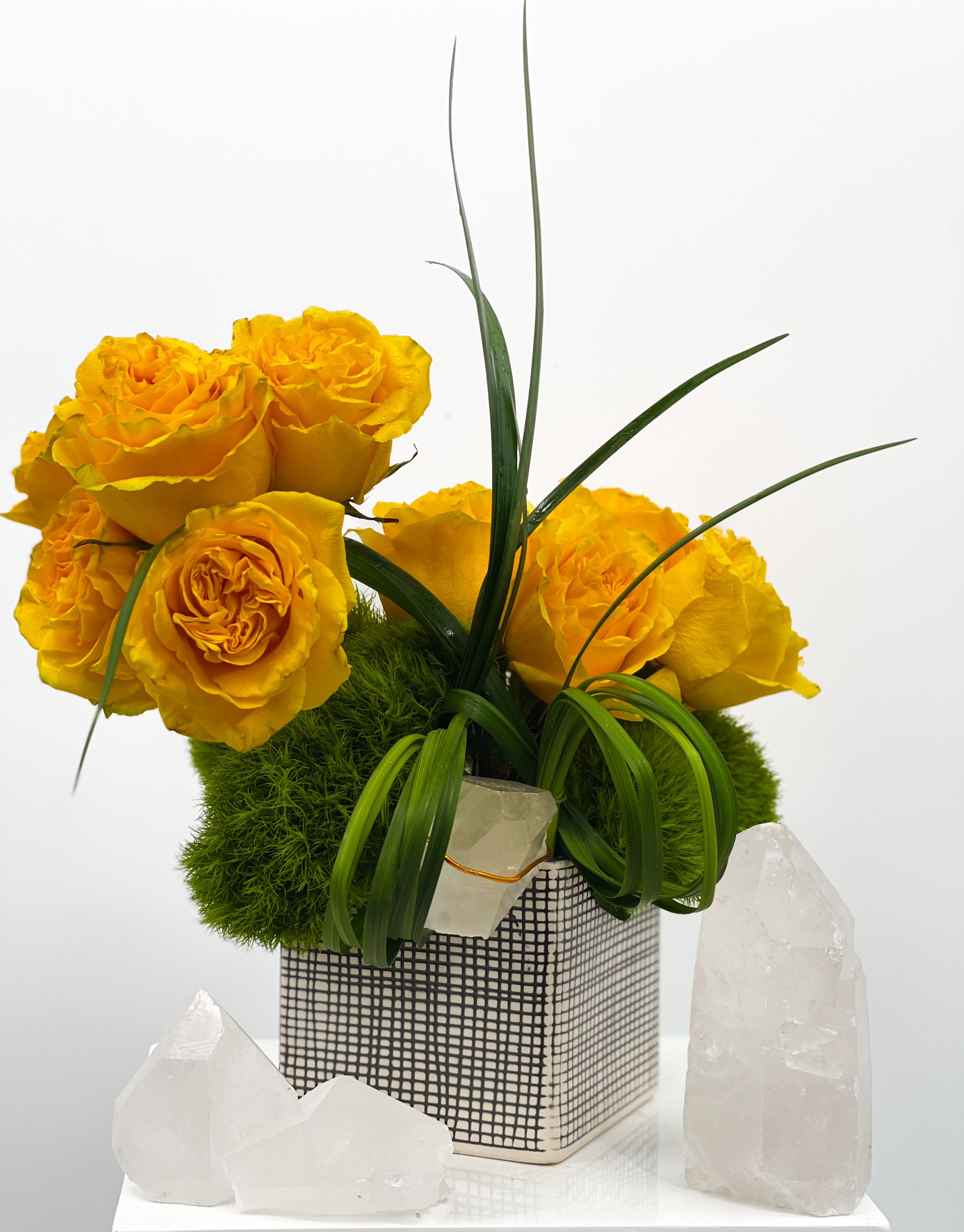 Marty - A set of yellow roses to brighten up anyones day. These luscious yellow roses paired with a vibrant green is perfect for any occasion. 