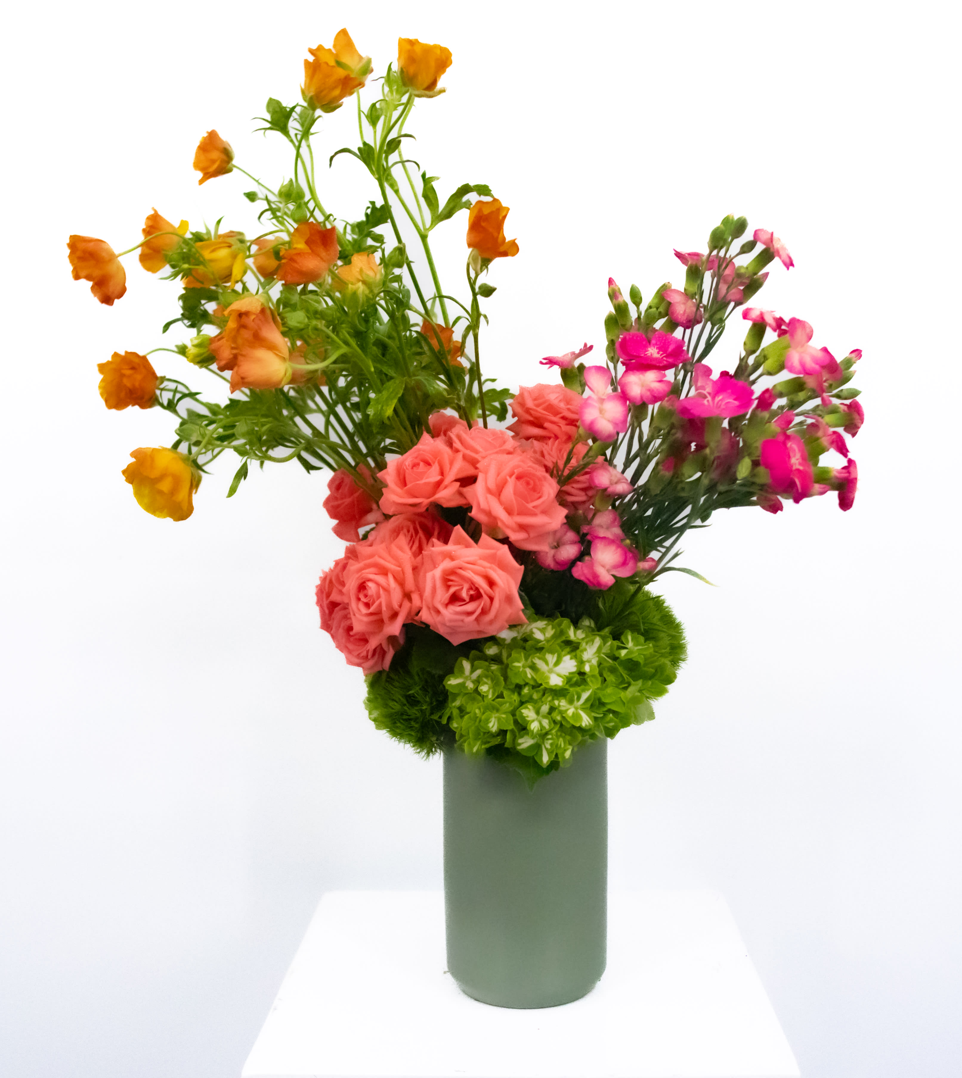 Cheri  - They say beauty is in the eye of the beholder, yet with this arrangement it is undeniable. The journey your eye takes on this piece is something that calms everyone who see's it. Created with colorful seasonal florals and placed in a tall vase. This piece is sure to bring smiles and joy to all. 