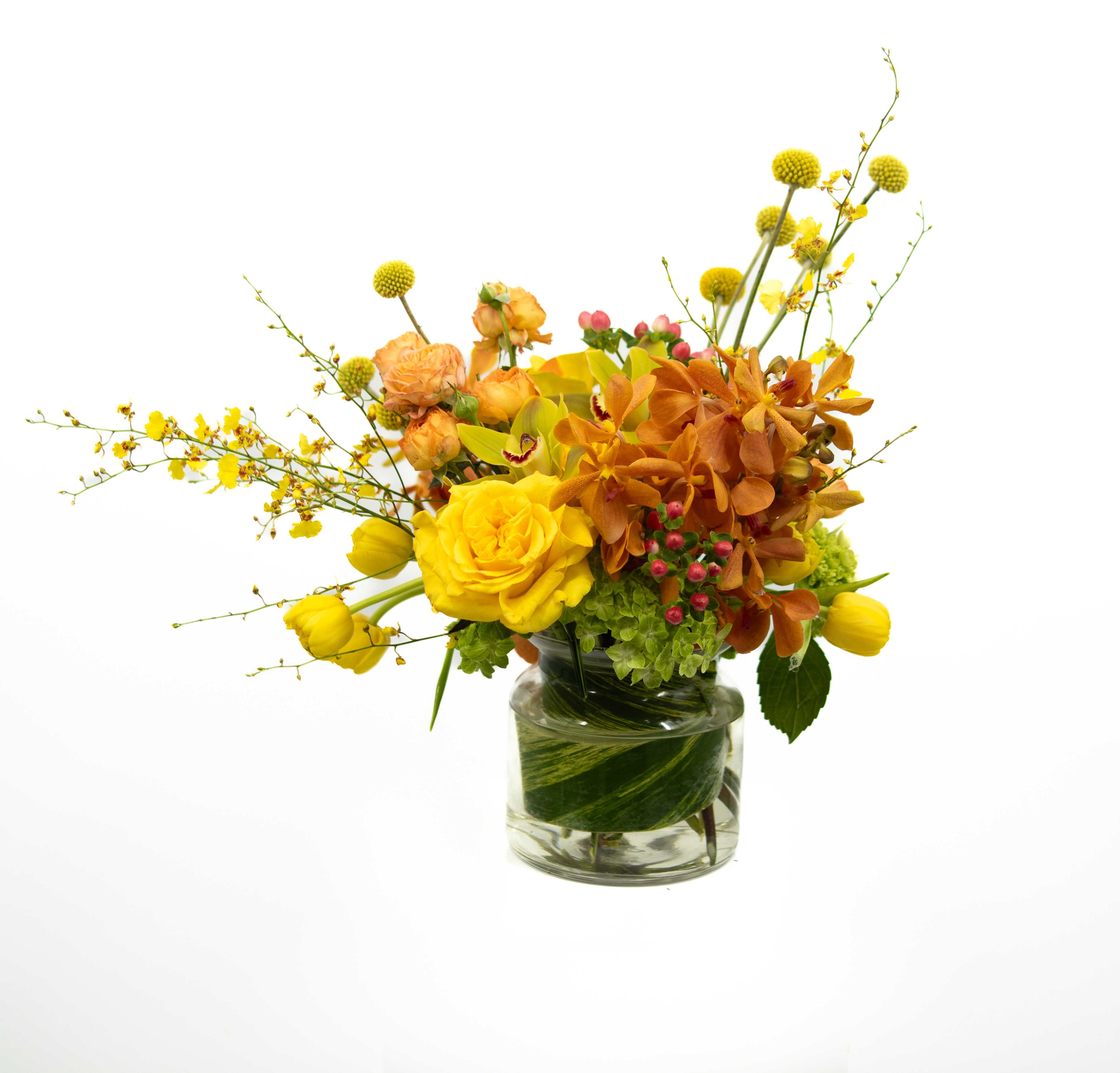 Kristen - An arrangement built to impress, assembled of monochromatic colors including orchids, tulips, craspedia and roses