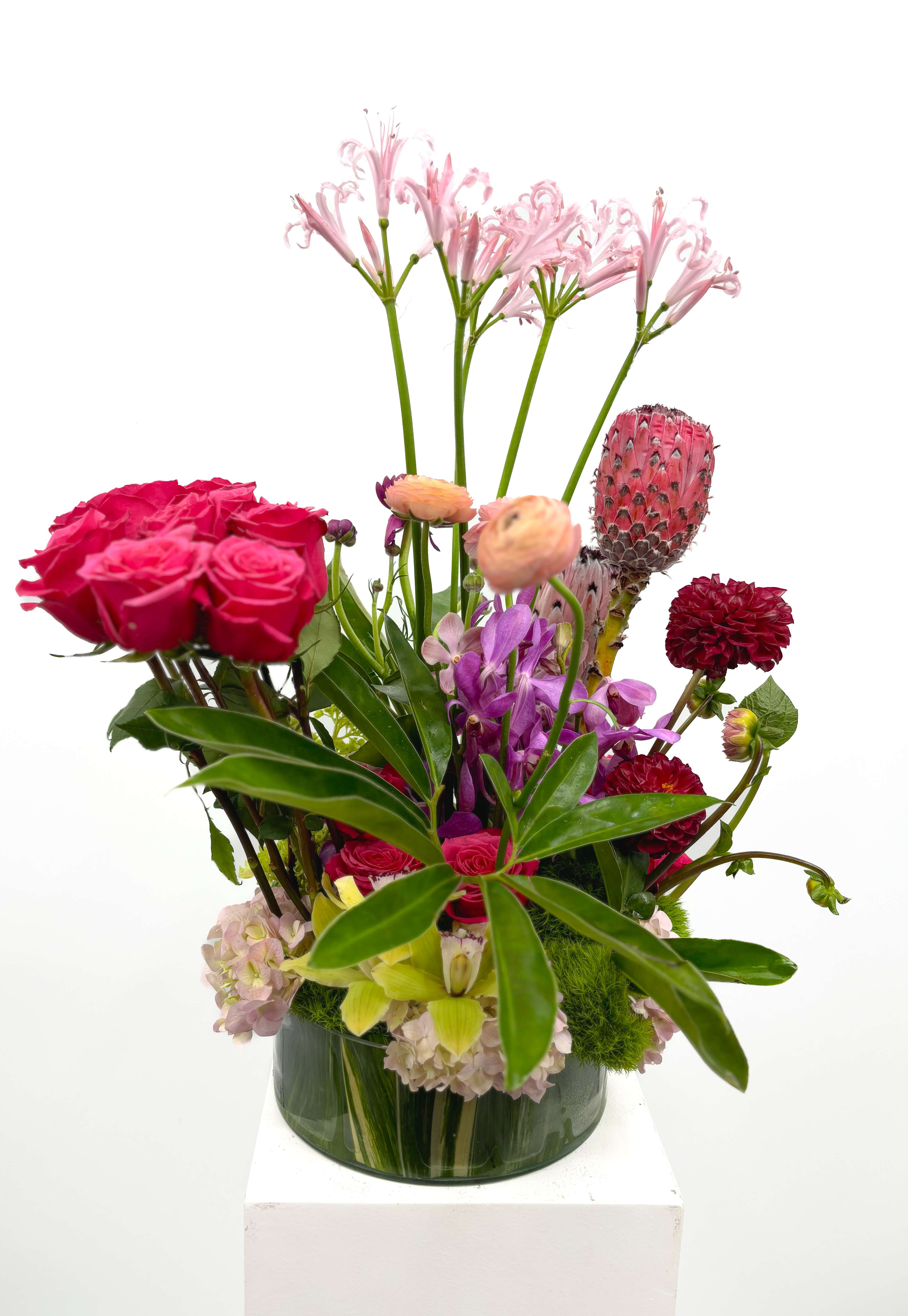 Amelia - Gorgeous arrangement that is built with the highest quality of flowers. This piece is designed out of so many beautiful florals that it will do everything but start the conversation for you. It is sure to spark joy in anyone who sees it. 